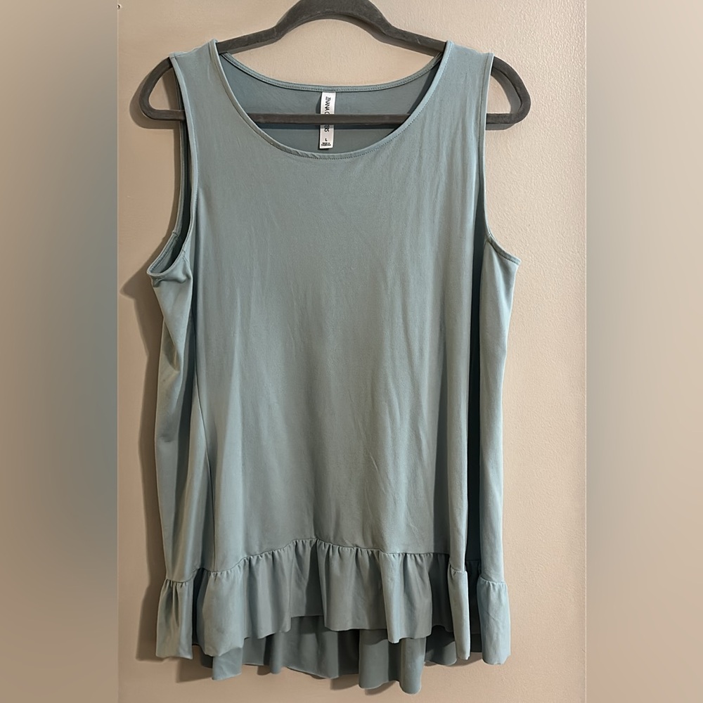 Flowy Sleeveless Top with Ruffle Hem